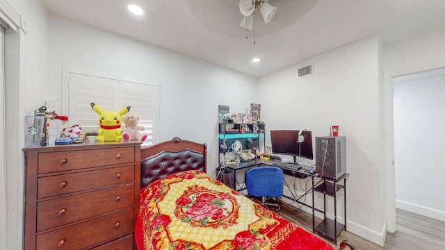 bedroom featuring recessed lighting, visible vents, a ceiling fan, wood finished floors, and baseboards