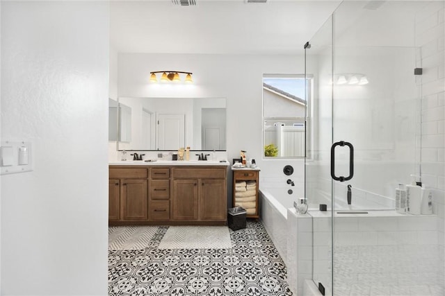 bathroom with separate shower and tub, vanity, and tile patterned flooring