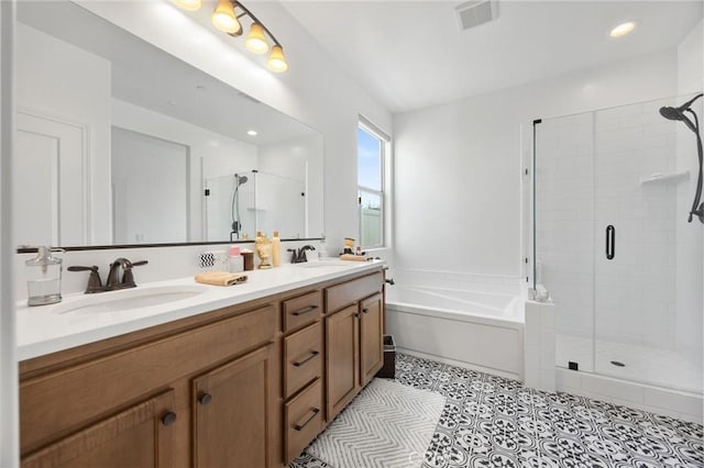 bathroom with vanity and independent shower and bath