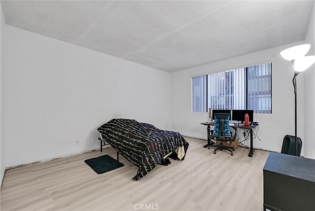 bedroom with light hardwood / wood-style flooring