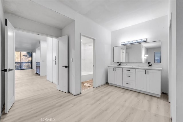 bathroom featuring vanity and hardwood / wood-style flooring