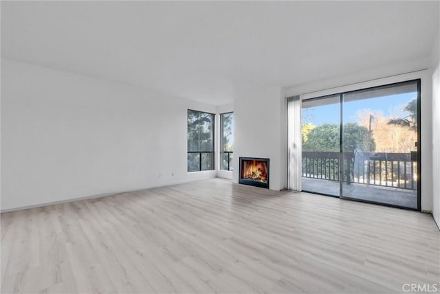 unfurnished living room with light hardwood / wood-style flooring