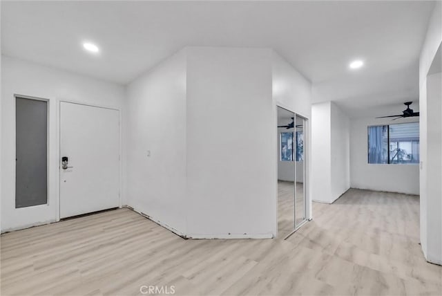 interior space with ceiling fan and light hardwood / wood-style floors