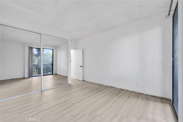 unfurnished room with light hardwood / wood-style flooring