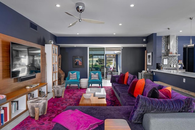 living room with sink and ceiling fan