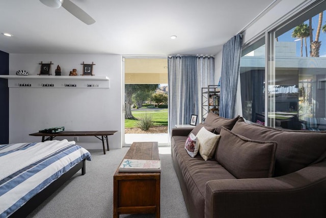 bedroom with access to exterior, carpet floors, and ceiling fan