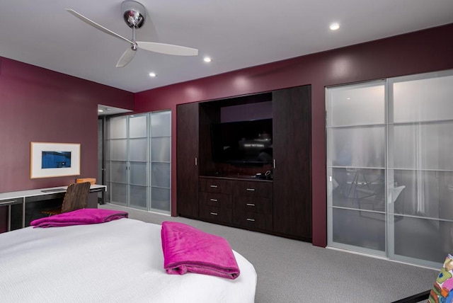 bedroom featuring ceiling fan and light carpet