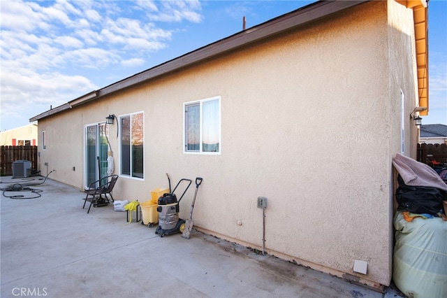 back of house with a patio and central air condition unit