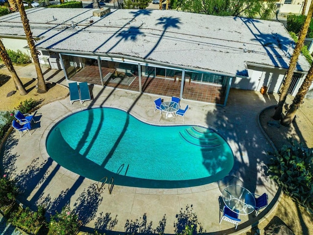 view of pool featuring a patio