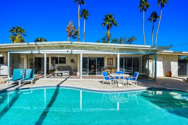 view of swimming pool featuring a patio area