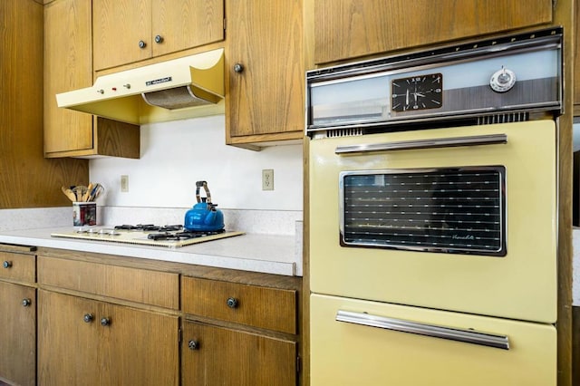 kitchen featuring white gas stovetop and double wall oven