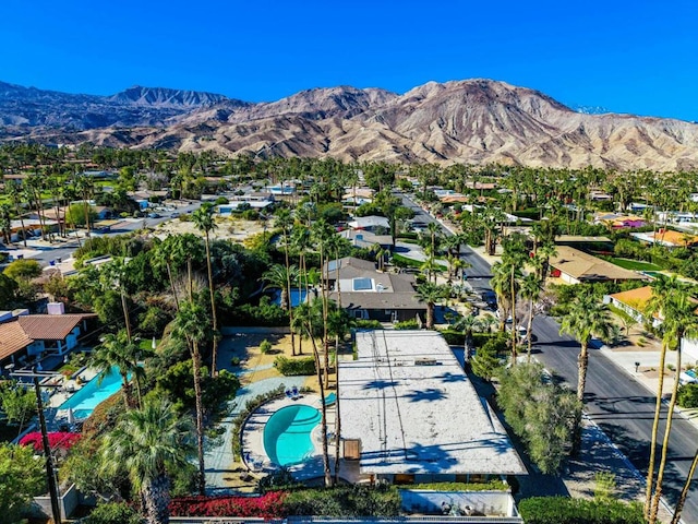 birds eye view of property featuring a mountain view