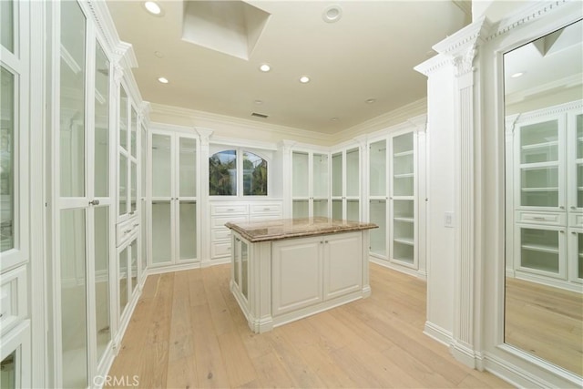 walk in closet featuring light hardwood / wood-style flooring