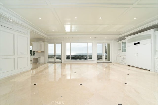 unfurnished living room featuring crown molding, french doors, and coffered ceiling