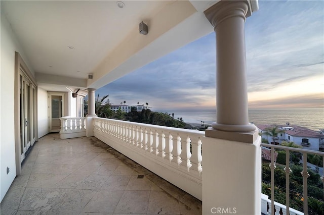 balcony at dusk with a water view