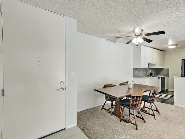 tiled dining room with ceiling fan