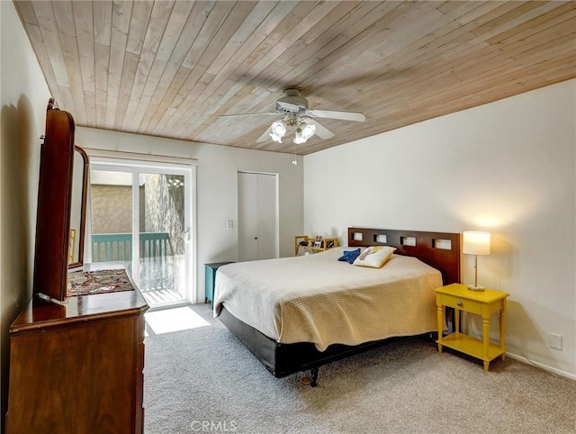 carpeted bedroom featuring access to exterior, wooden ceiling, and ceiling fan