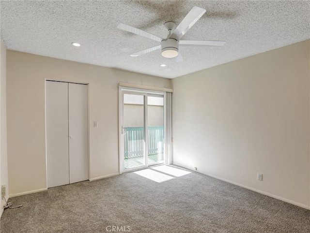 unfurnished bedroom featuring access to exterior, carpet floors, ceiling fan, a textured ceiling, and baseboards