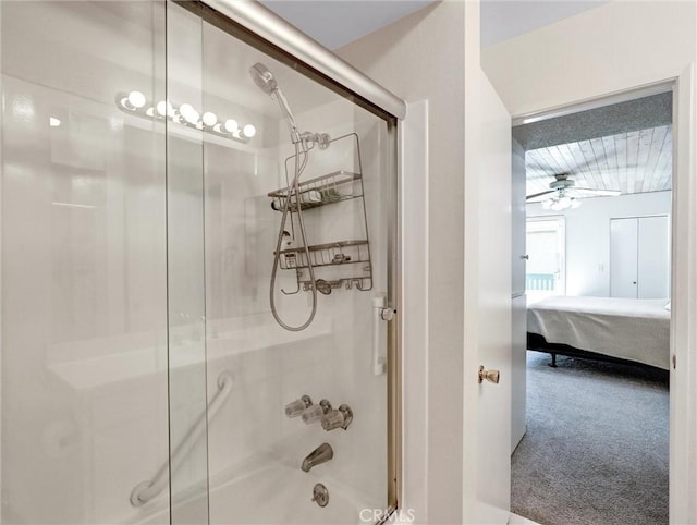 ensuite bathroom with a ceiling fan, enclosed tub / shower combo, and ensuite bathroom