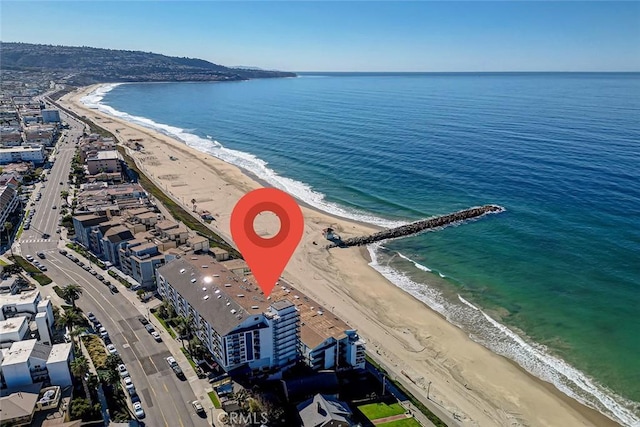 aerial view featuring a water view and a beach view