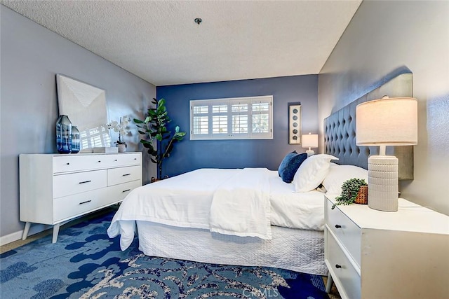 bedroom featuring a textured ceiling