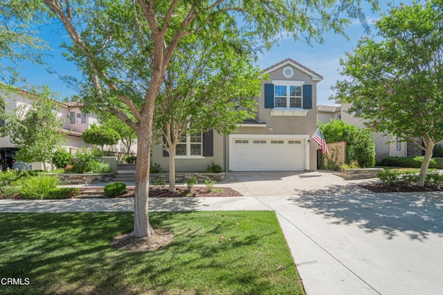 view of front of property featuring a front lawn and a garage