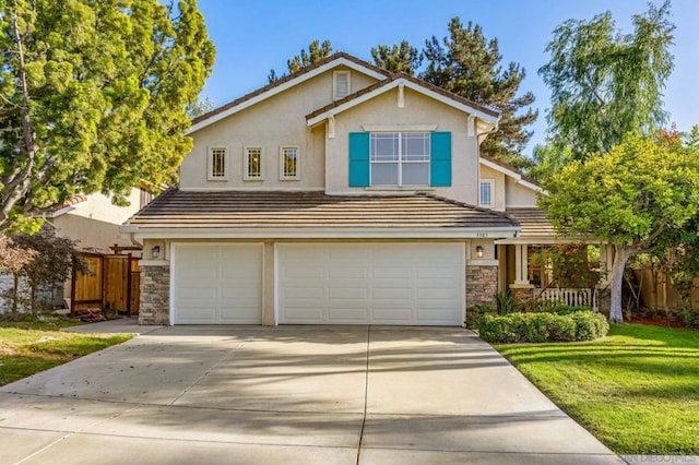 front of property with a front lawn and a garage