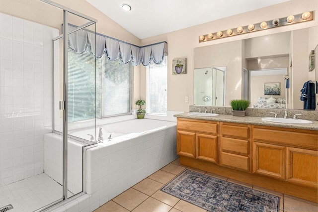 bathroom with lofted ceiling, plus walk in shower, tile patterned floors, and vanity