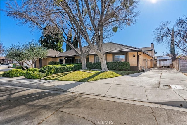 ranch-style house with a front lawn