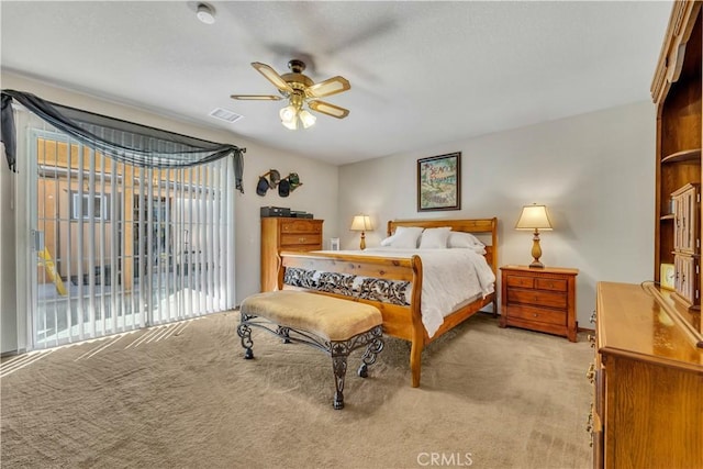 bedroom featuring ceiling fan, access to exterior, and light carpet