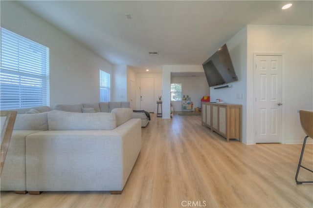 living room with light hardwood / wood-style floors