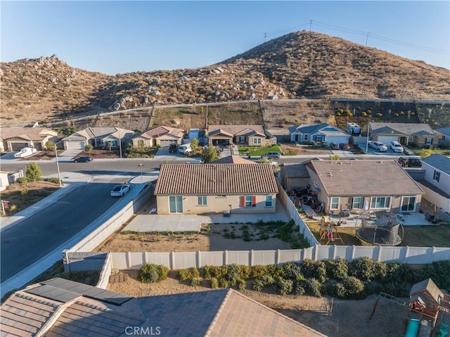 birds eye view of property with a mountain view