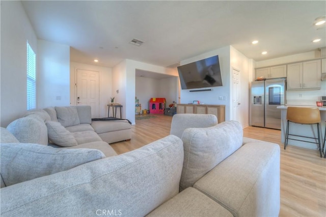 living room featuring light wood-type flooring