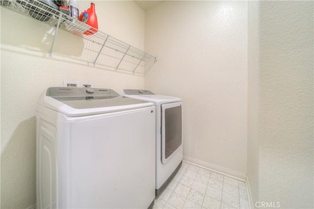 washroom featuring washing machine and dryer