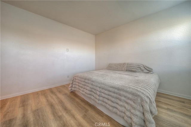 bedroom with light wood-type flooring