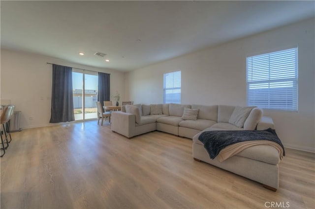 living room with light hardwood / wood-style floors