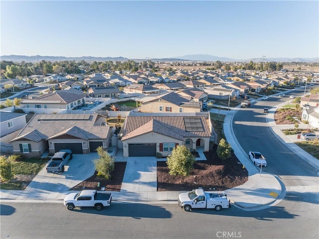 birds eye view of property featuring a mountain view