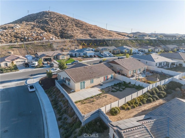 birds eye view of property featuring a mountain view