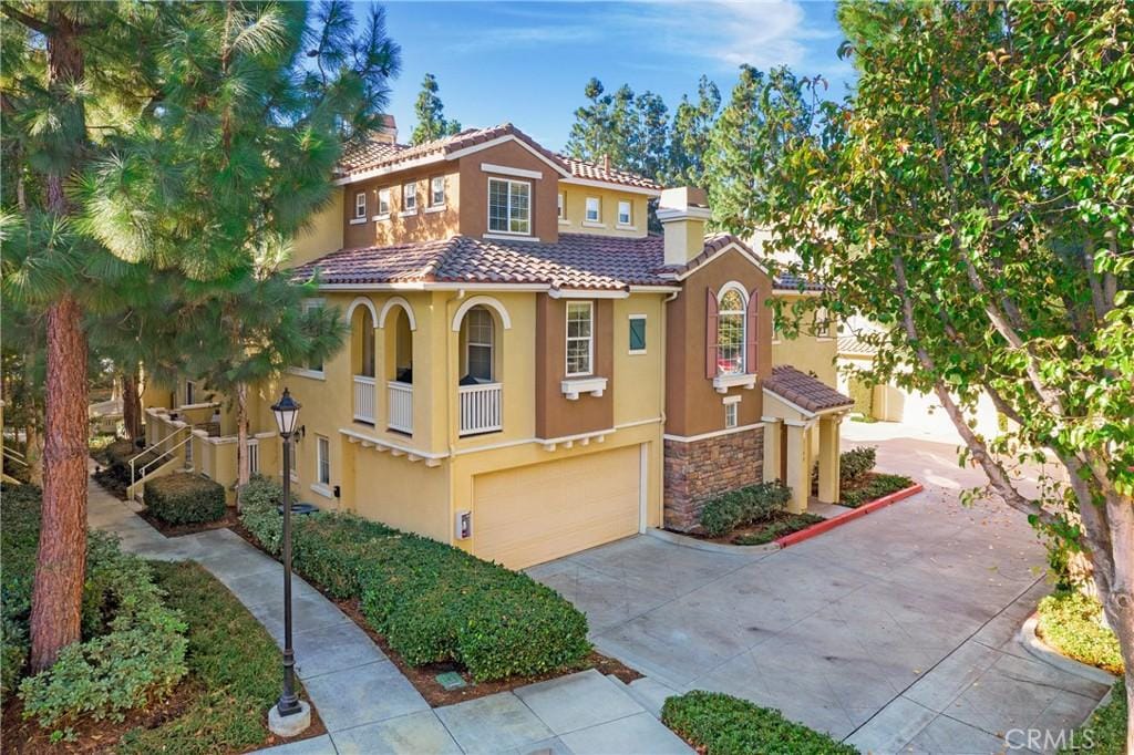 mediterranean / spanish house featuring a garage