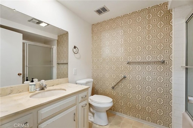 full bathroom with toilet, shower / bath combination with glass door, and vanity