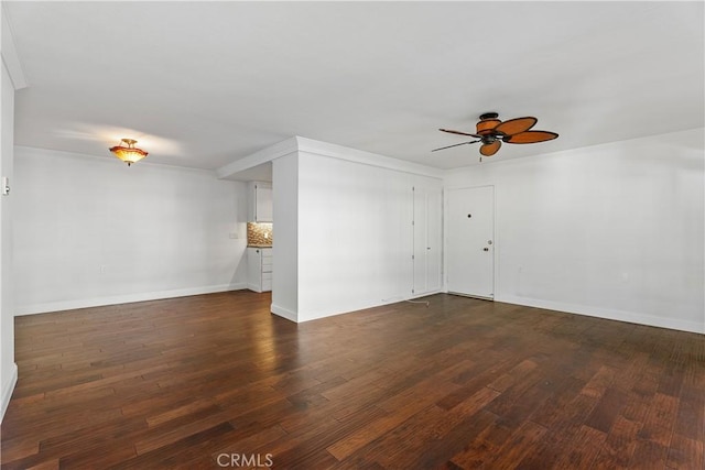 interior space featuring dark wood-type flooring and ceiling fan