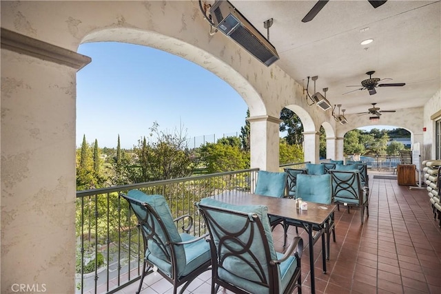 exterior space featuring a balcony and ceiling fan