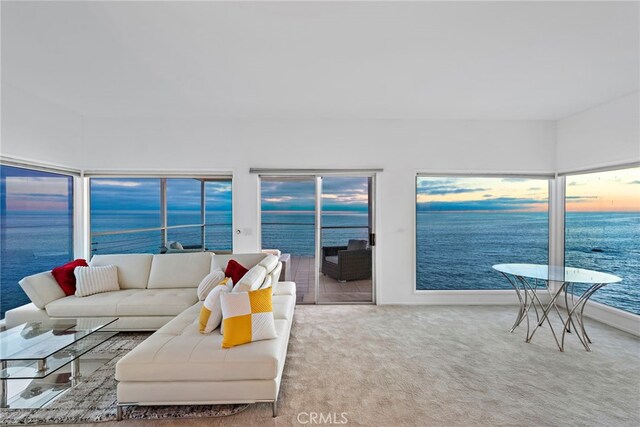 sunroom / solarium with a water view