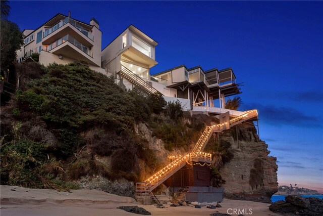 view of outdoor building at dusk