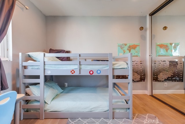 bedroom with hardwood / wood-style flooring