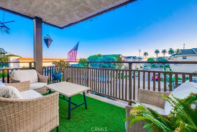 balcony at dusk with an outdoor living space