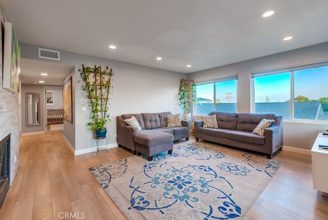 living room featuring light hardwood / wood-style flooring and a wealth of natural light