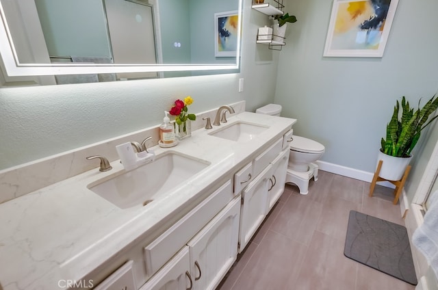 bathroom featuring toilet and vanity