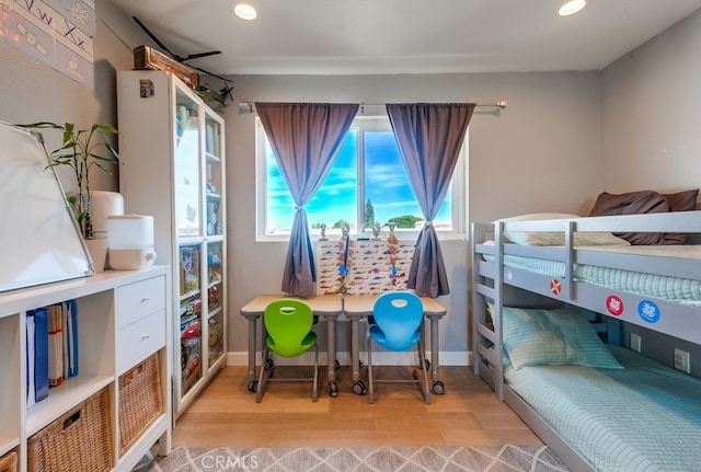 bedroom with light hardwood / wood-style floors