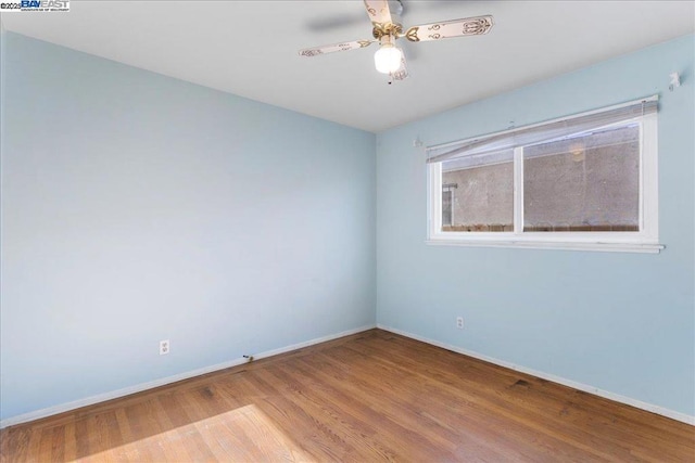 unfurnished room featuring light hardwood / wood-style floors and ceiling fan